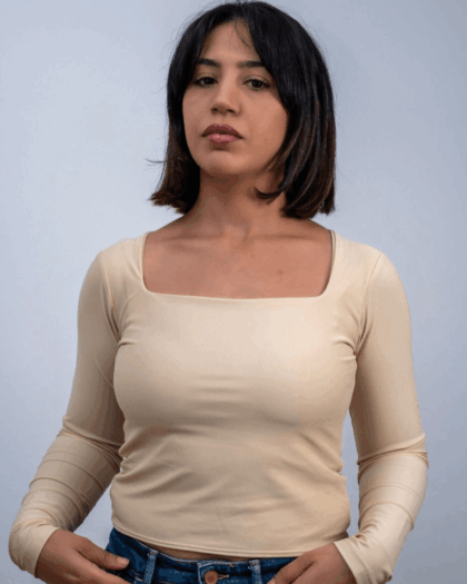 Model wearing a beige square top in a standing pose, showcasing the front design.